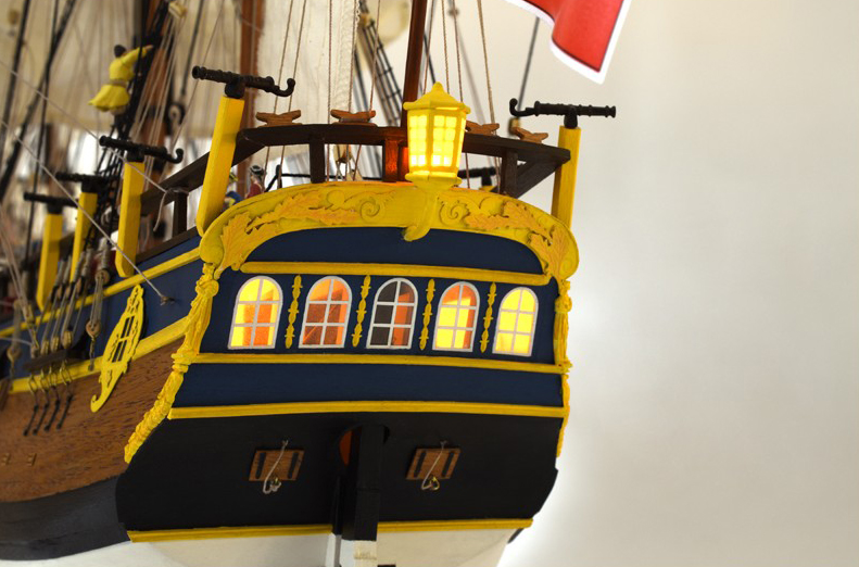 Naval modeling. The windows allow light to shine on the New 1/65 HMS Endeavour Wooden Ship Model (22520).